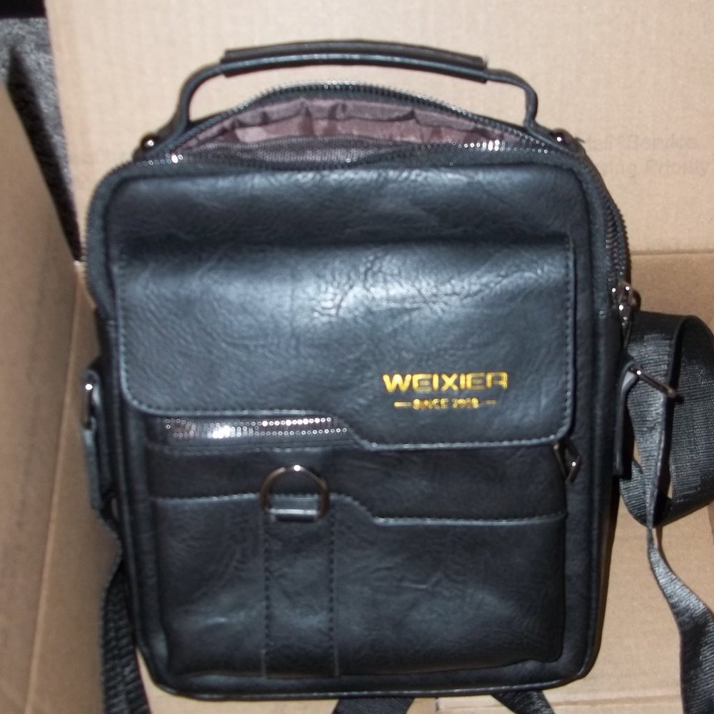 Genuine leather technology case. On the newer side. Black.